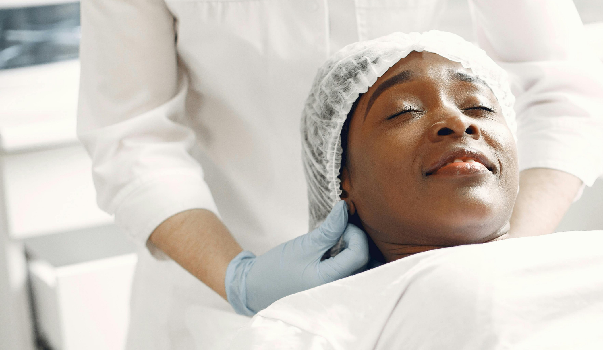 Woman in a shower cap relaxing at a medspa in Panama City