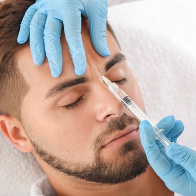 a man undergoing BOTOX treatment for forehead wrinkles
