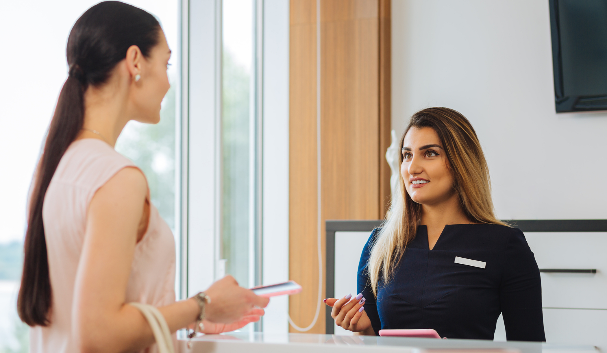 Panama City medspa team member talking to a patient