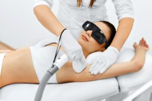Woman relaxing while undergoing laser hair removal